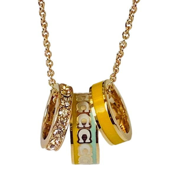 NEW Coach Buttercup Goldtone Enamel and Crystal Pendant on Card w/Dust Bag $168 - Picture 1 of 9